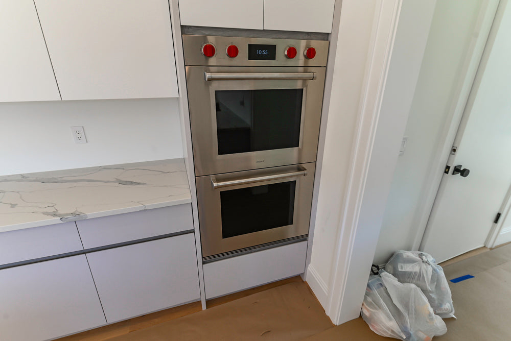 Large White Modern Kitchen with Island and Quartz Countertops