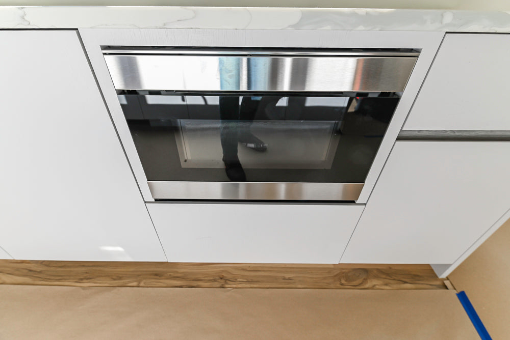 Large White Modern Kitchen with Island and Quartz Countertops