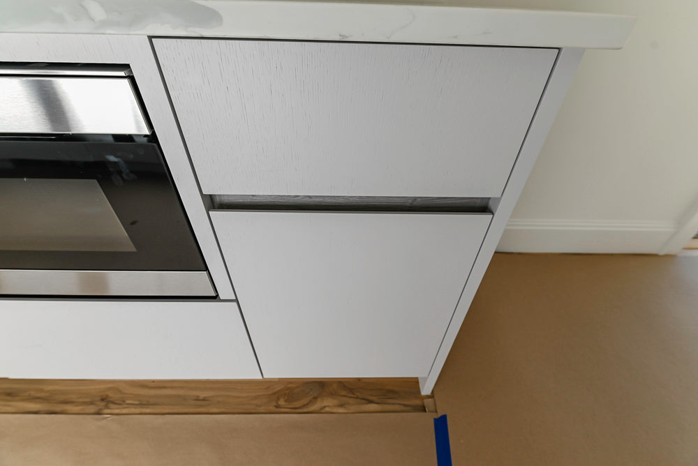 Large White Modern Kitchen with Island and Quartz Countertops