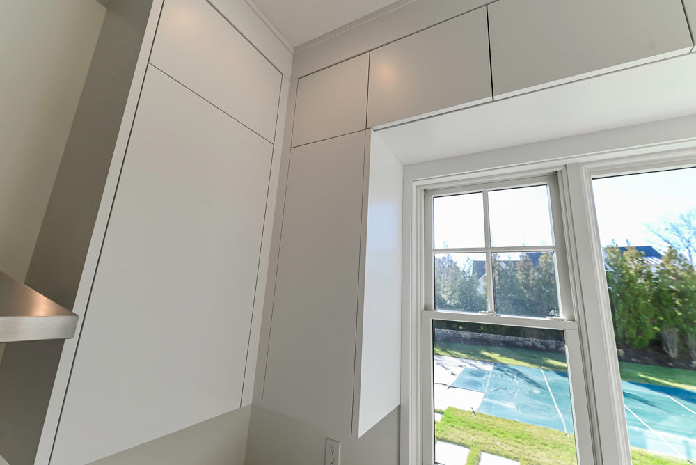 Large White Modern Kitchen with Island and Quartz Countertops