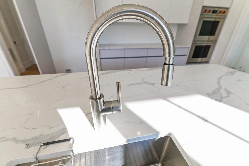 Large White Modern Kitchen with Island and Quartz Countertops