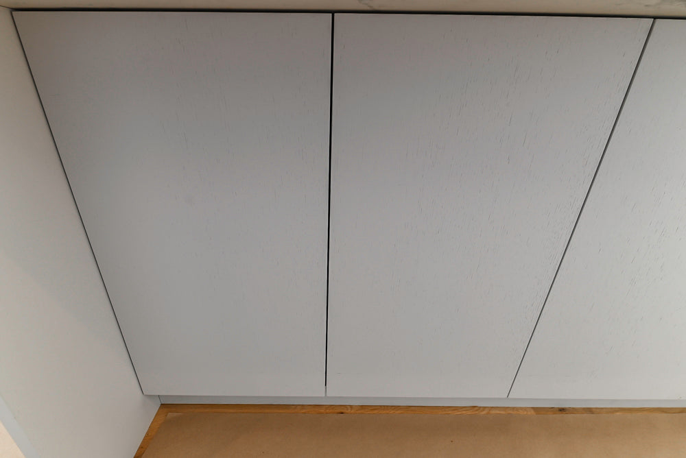 Large White Modern Kitchen with Island and Quartz Countertops