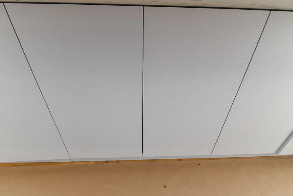 Large White Modern Kitchen with Island and Quartz Countertops