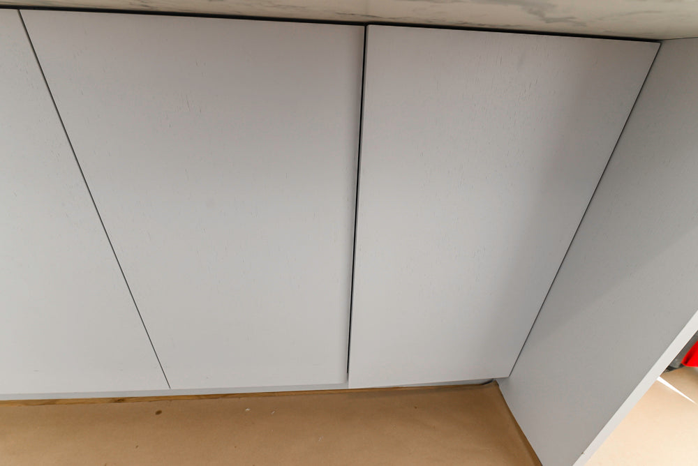 Large White Modern Kitchen with Island and Quartz Countertops