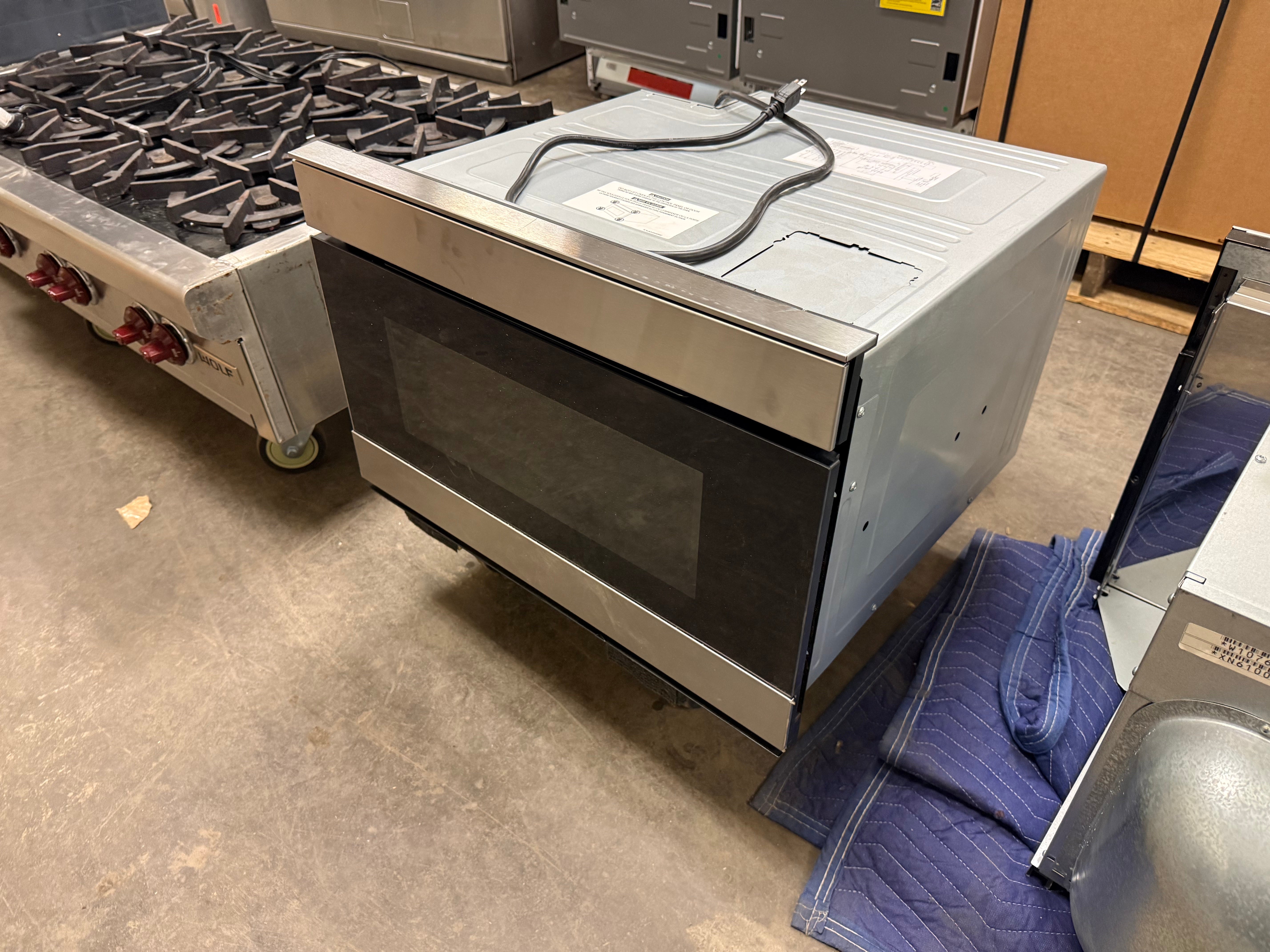 Modern kitchen featuring a flush-mounted Sharp SMD2489ES microwave