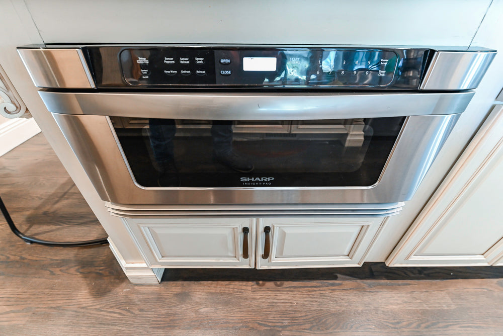 Schrock Traditional Cream Kitchen with Island and Granite Countertops