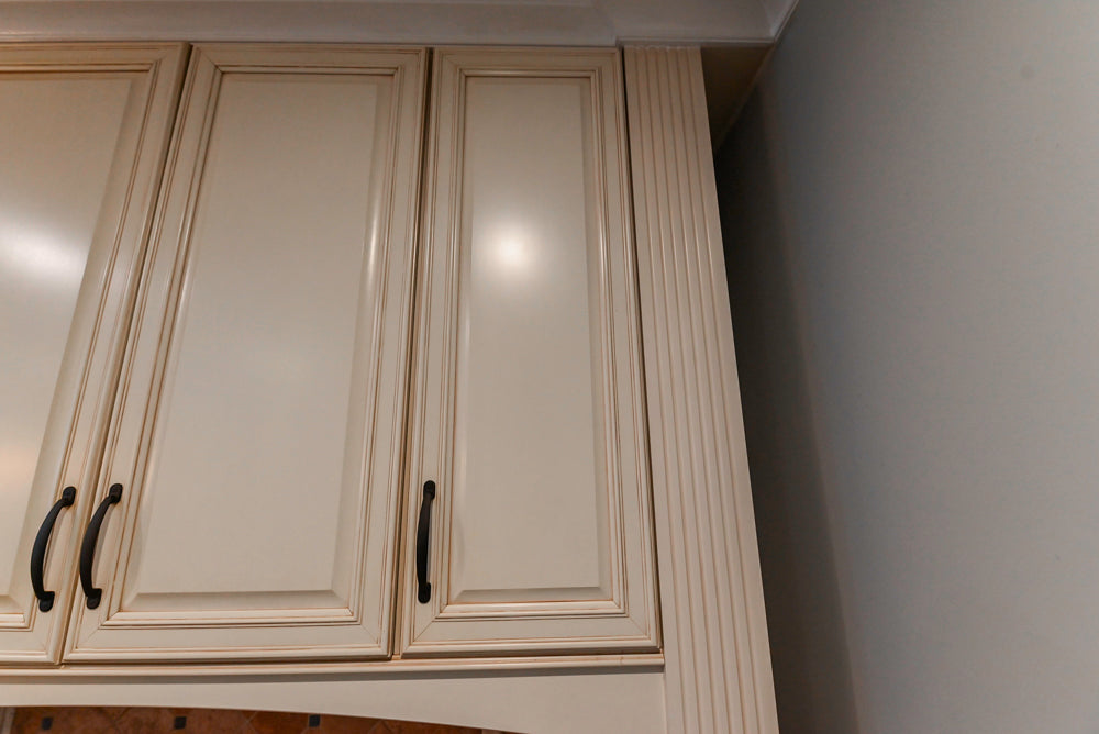 Schrock Traditional Cream Kitchen with Island and Granite Countertops