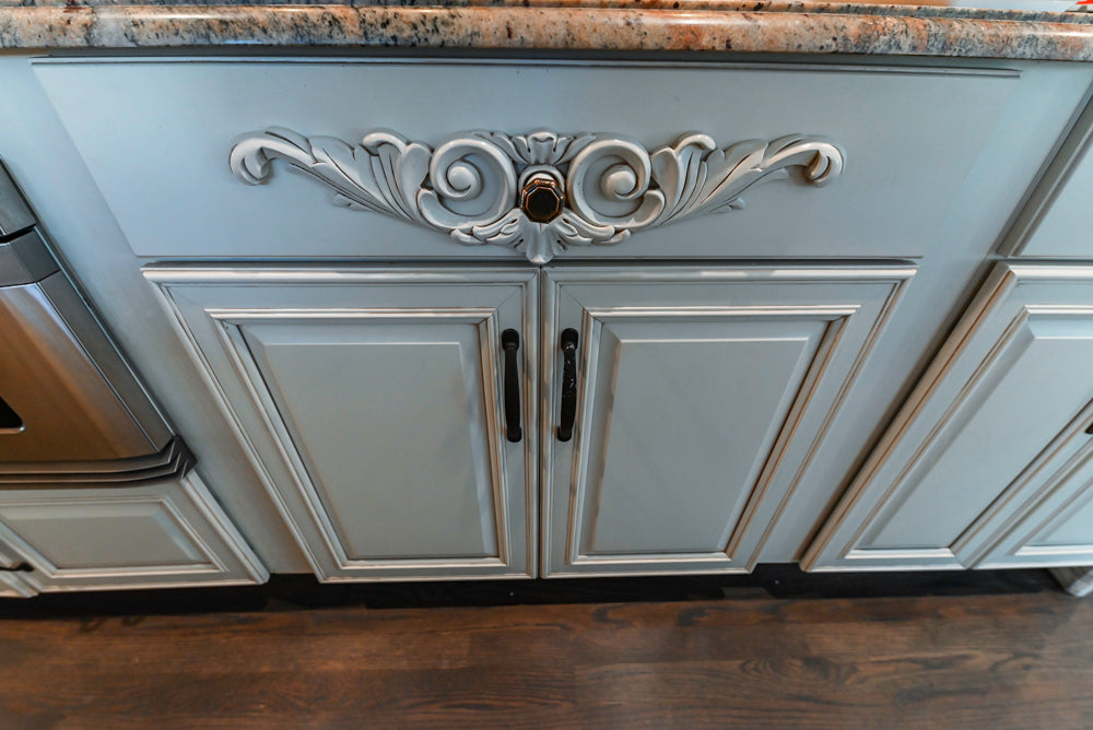 Schrock Traditional Cream Kitchen with Island and Granite Countertops