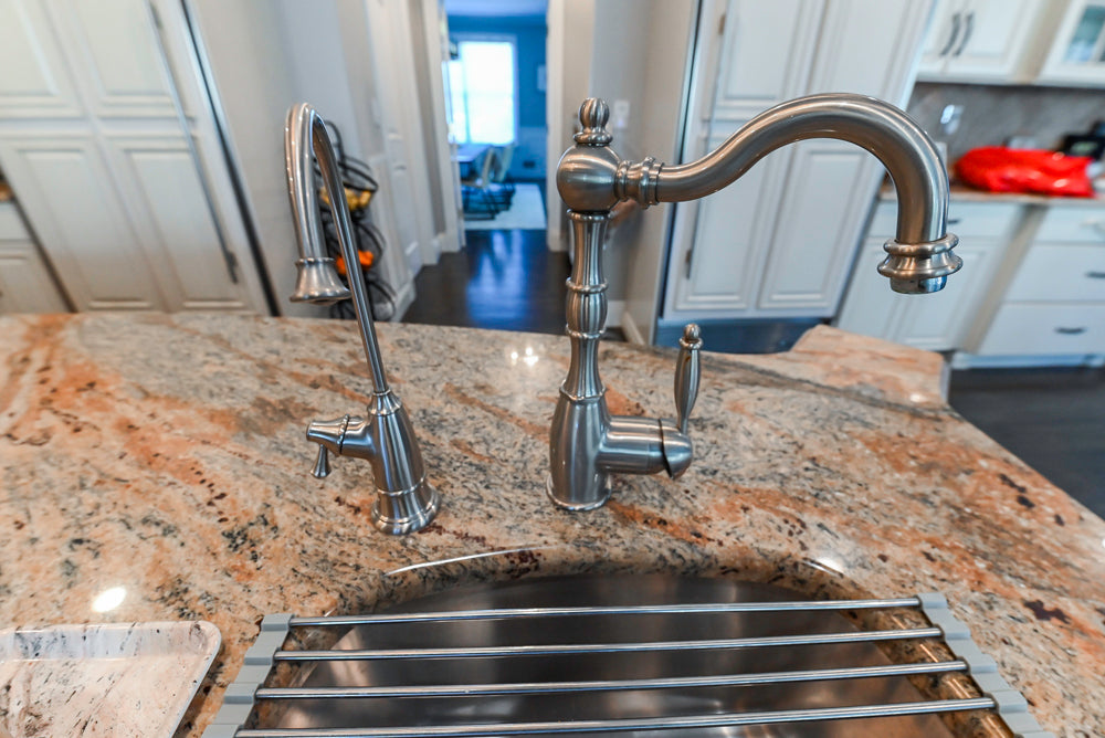 Schrock Traditional Cream Kitchen with Island and Granite Countertops