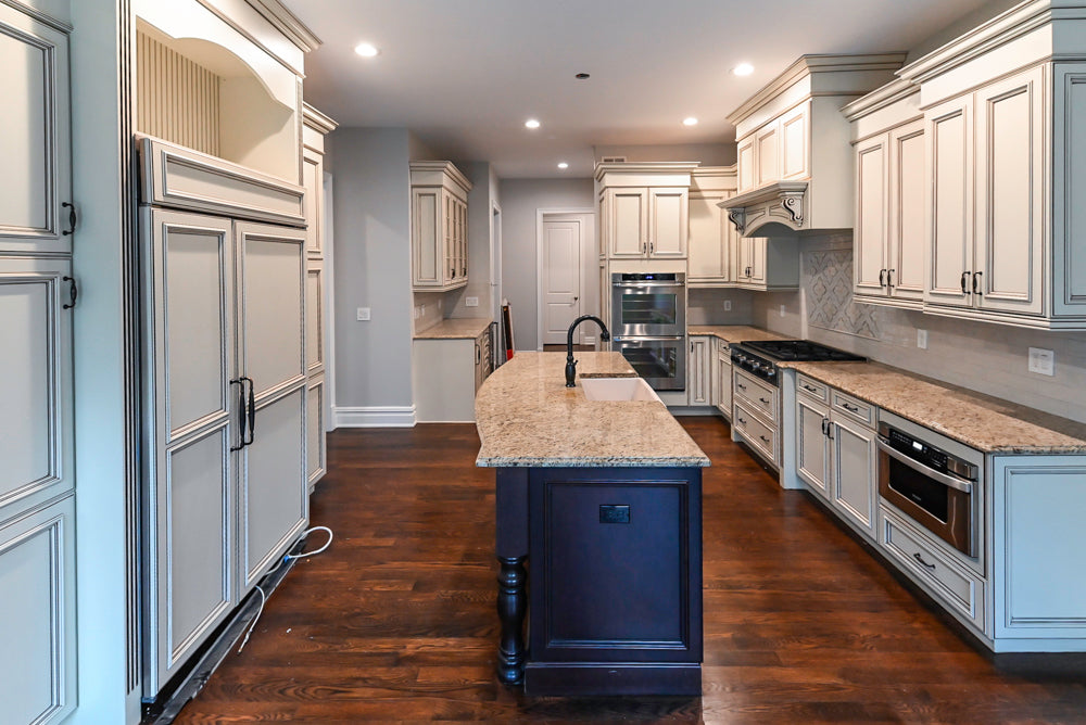 Kitchen Craft Traditional White Kitchen with Island, Granite Countertops and Appliances