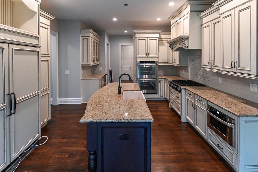 Kitchen Craft Traditional White Kitchen with Island, Granite Countertops and Appliances