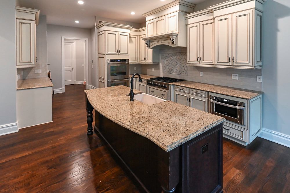 Kitchen Craft Traditional White Kitchen with Island, Granite Countertops and Appliances