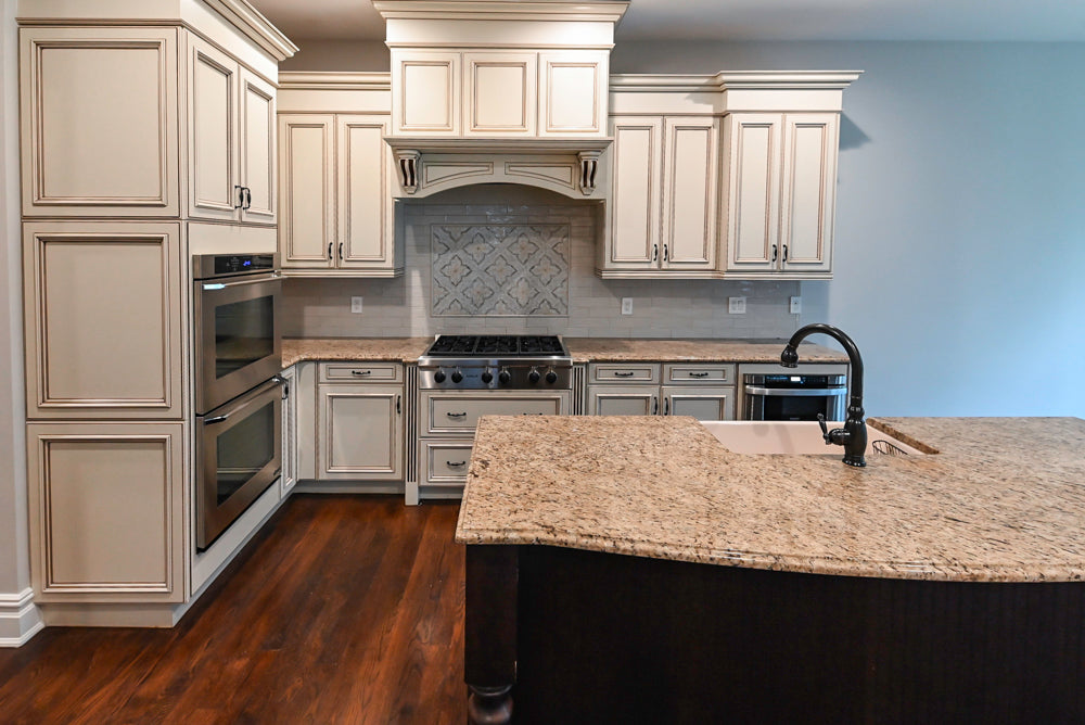 Kitchen Craft Traditional White Kitchen with Island, Granite Countertops and Appliances