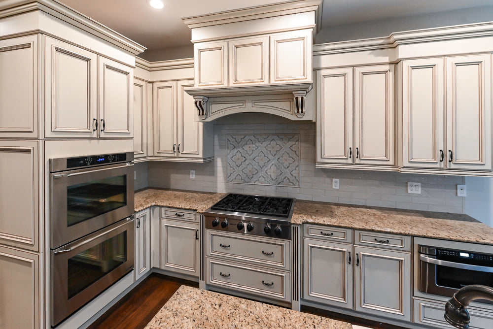 Kitchen Craft Traditional White Kitchen with Island, Granite Countertops and Appliances