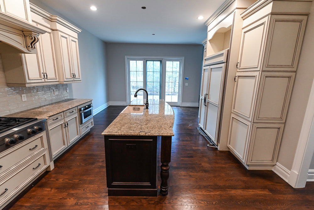 Kitchen Craft Traditional White Kitchen with Island, Granite Countertops and Appliances