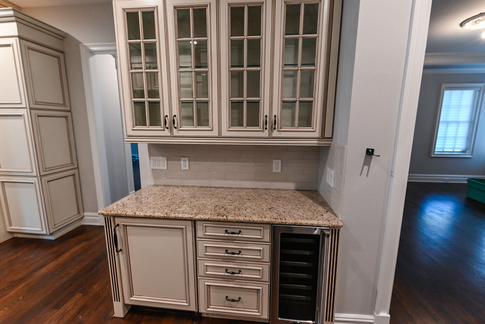 Kitchen Craft Traditional White Kitchen with Island, Granite Countertops and Appliances