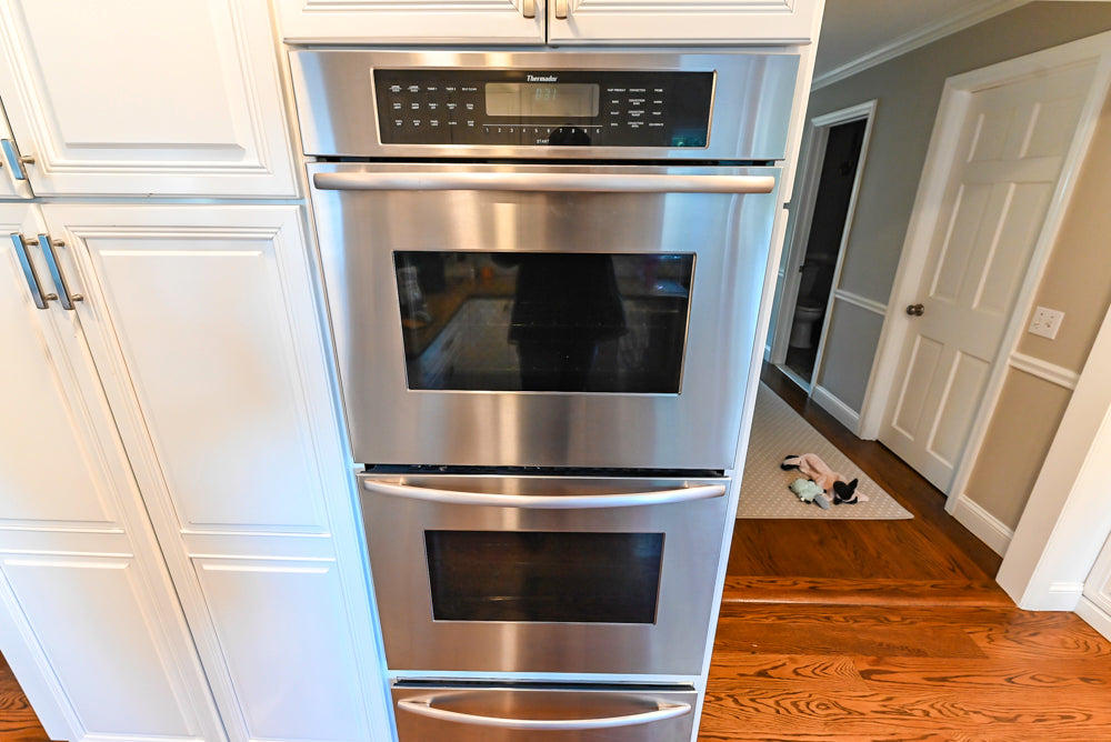 Traditional White Kitchen with Desk Area, Granite Countertops & Thermador Appliances