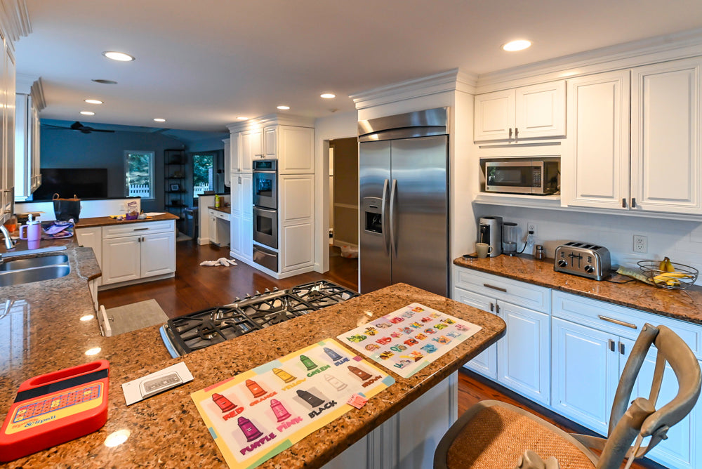 Traditional White Kitchen with Desk Area, Granite Countertops & Thermador Appliances