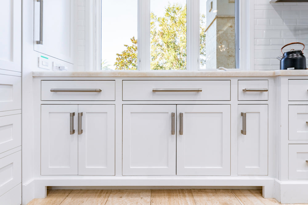 Transitional White Kitchen with Marble Countertops and Grand Island with Seating