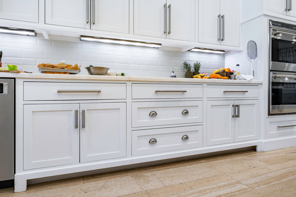 Transitional White Kitchen with Marble Countertops and Grand Island with Seating