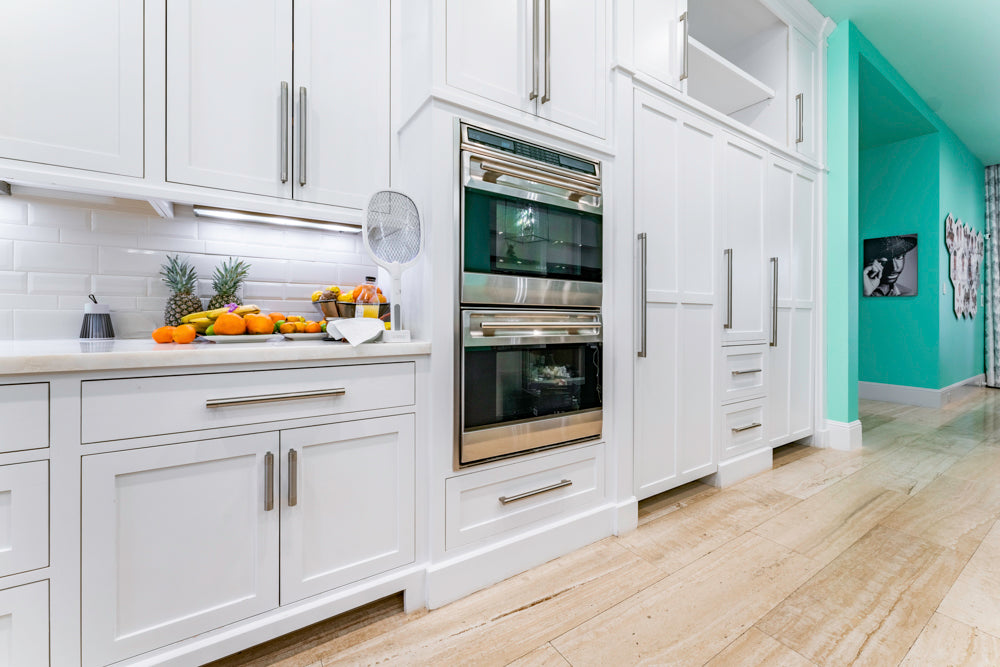 Transitional White Kitchen with Marble Countertops and Grand Island with Seating