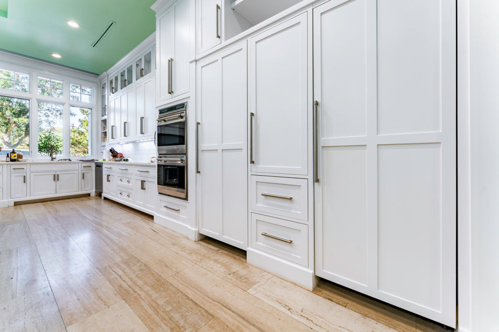 Transitional White Kitchen with Marble Countertops and Grand Island with Seating