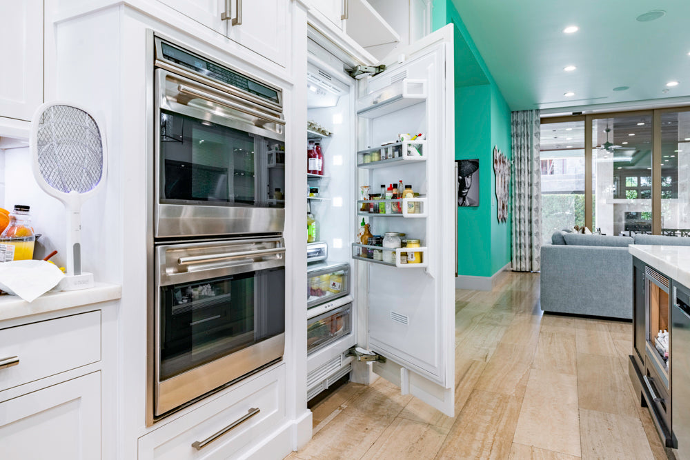 Transitional White Kitchen with Marble Countertops and Grand Island with Seating