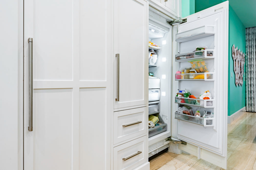 Transitional White Kitchen with Marble Countertops and Grand Island with Seating