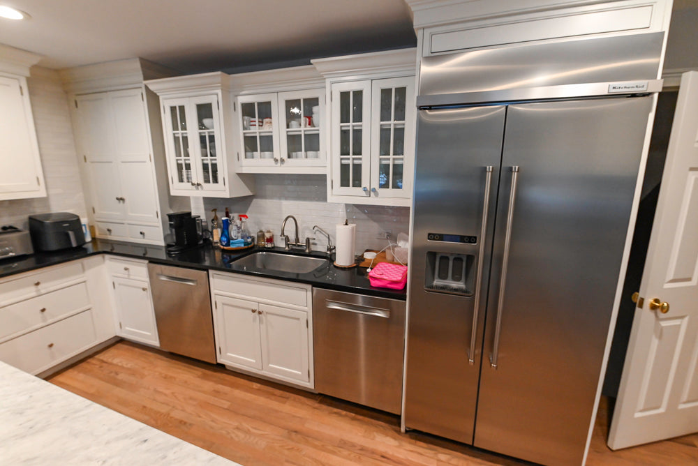 Traditional White Kitchen with Marble Top Island and Appliances