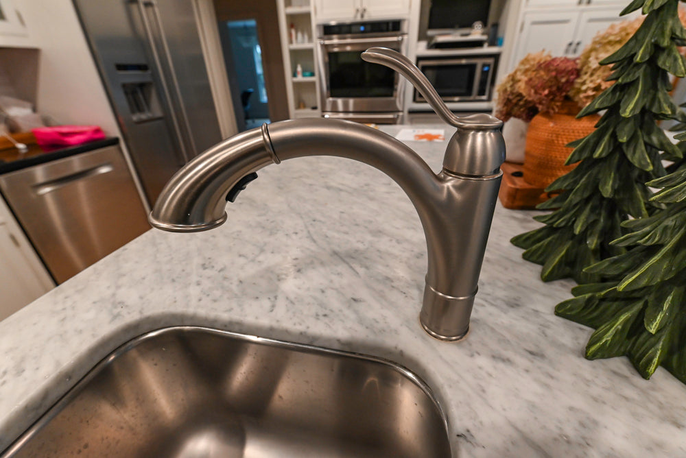 Traditional White Kitchen with Marble Top Island and Appliances