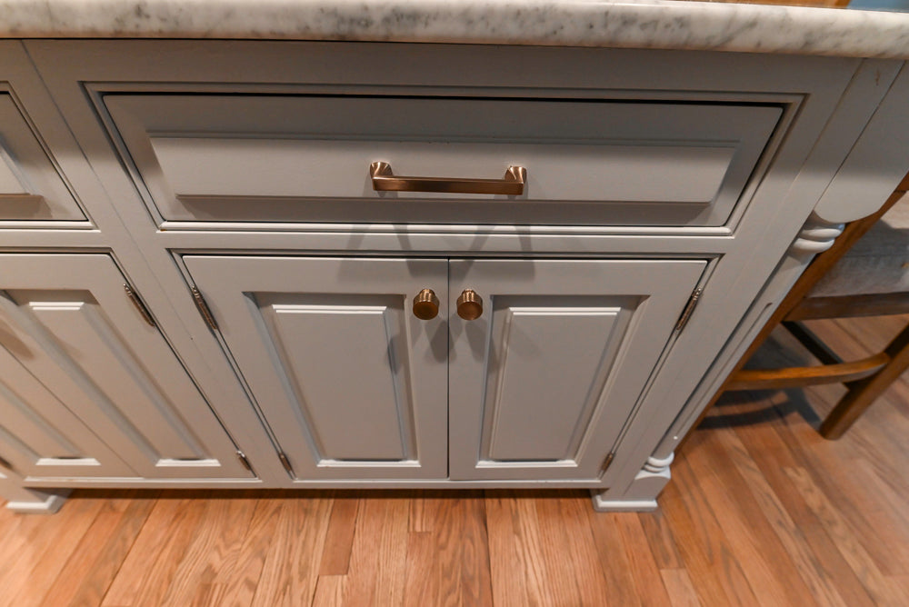 Traditional White Kitchen with Marble Top Island and Appliances