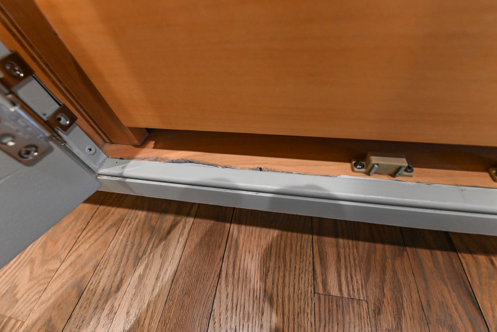 Traditional White Kitchen with Marble Top Island and Appliances