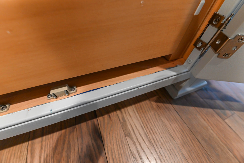 Traditional White Kitchen with Marble Top Island and Appliances