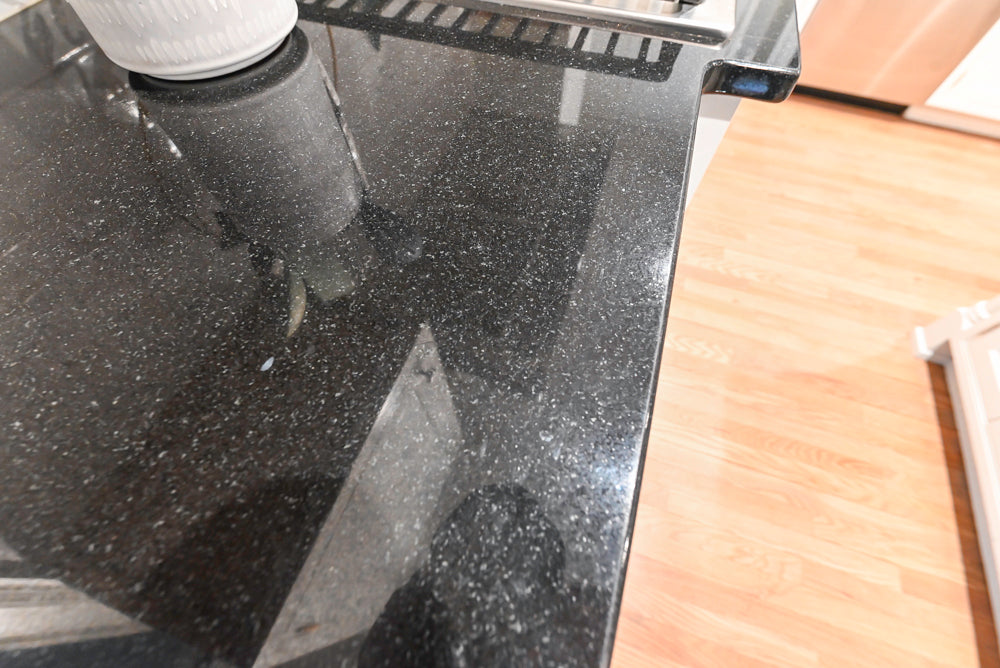 Traditional White Kitchen with Marble Top Island and Appliances