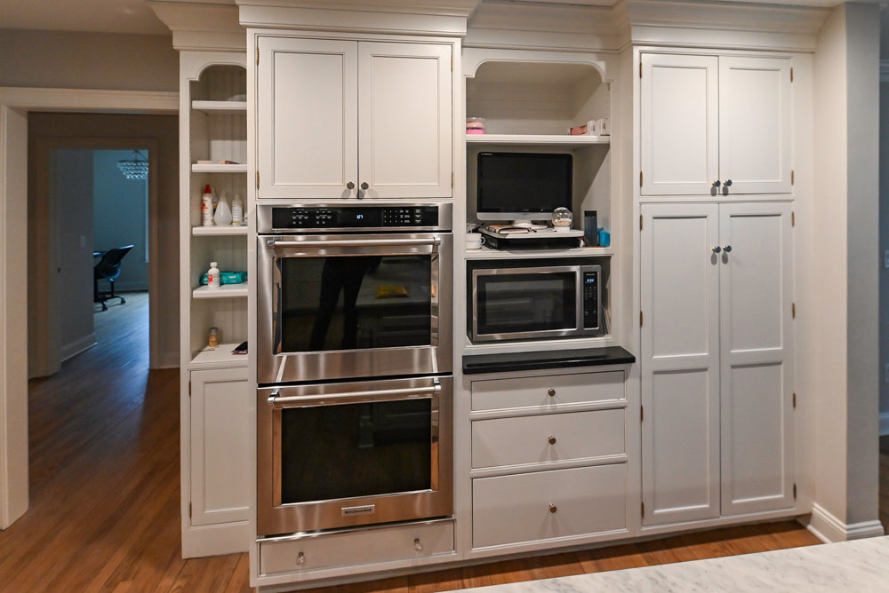 Traditional White Kitchen with Marble Top Island and Appliances