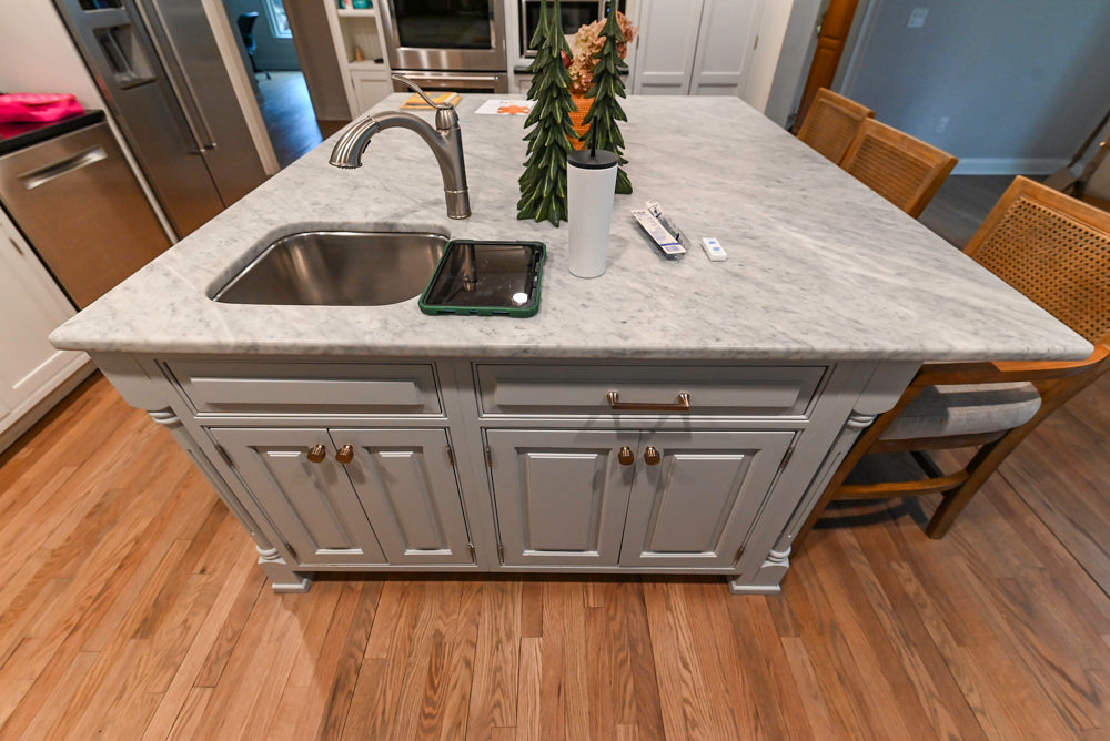 Traditional White Kitchen with Marble Top Island and Appliances