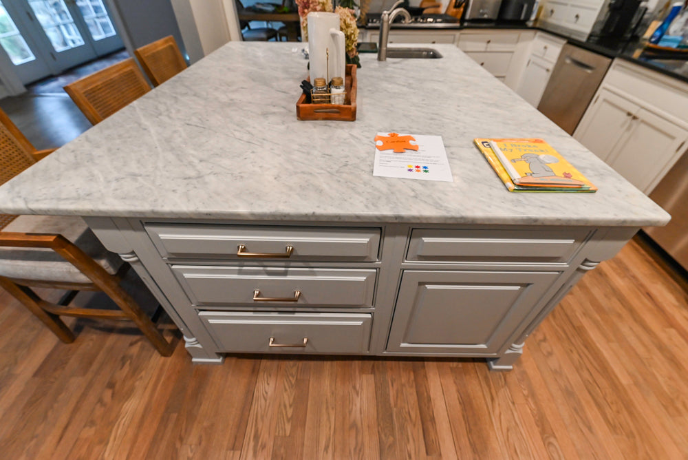Traditional White Kitchen with Marble Top Island and Appliances