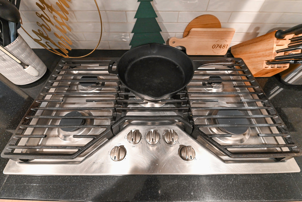 Traditional White Kitchen with Marble Top Island and Appliances