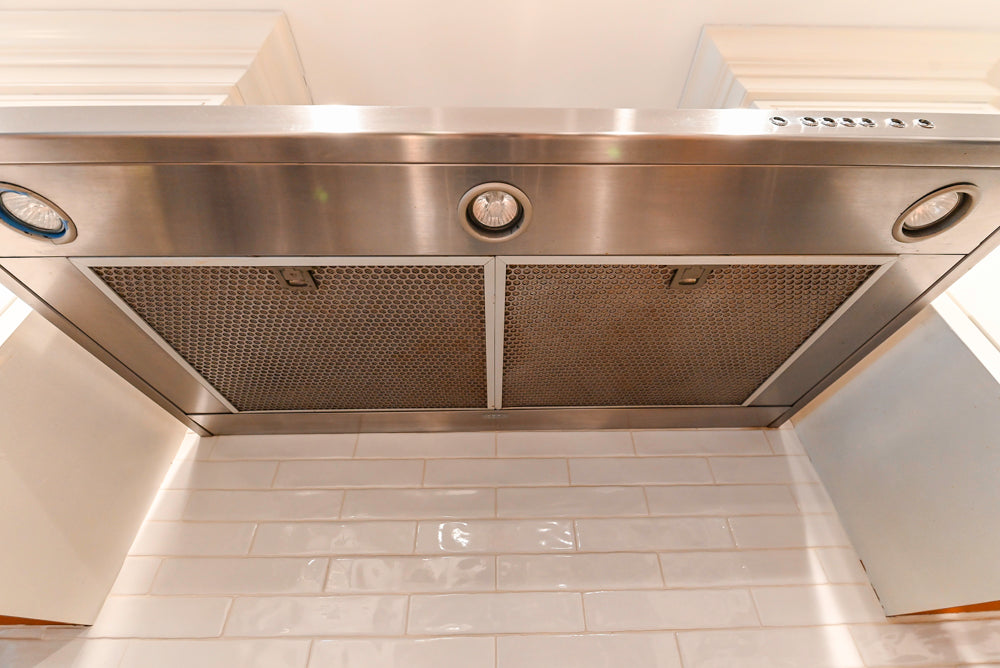 Traditional White Kitchen with Marble Top Island and Appliances