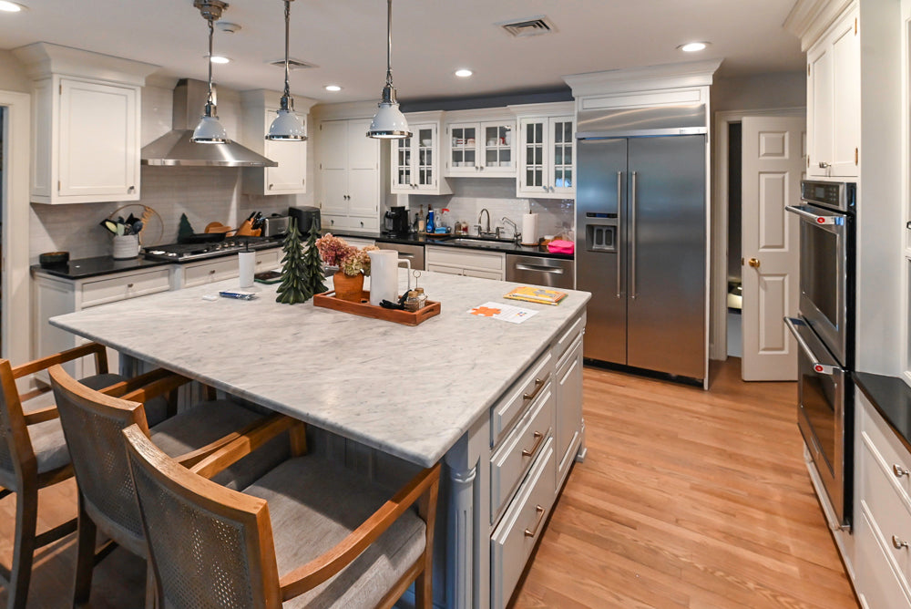 Traditional White Kitchen with Marble Top Island and Appliances