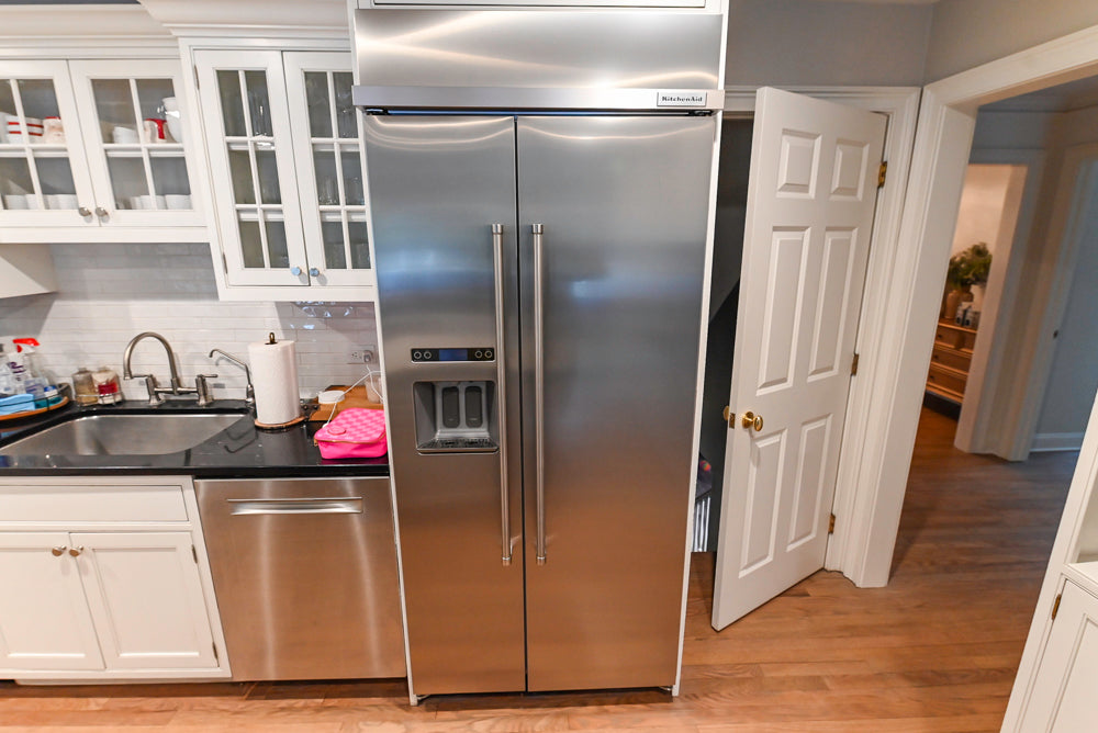 Traditional White Kitchen with Marble Top Island and Appliances