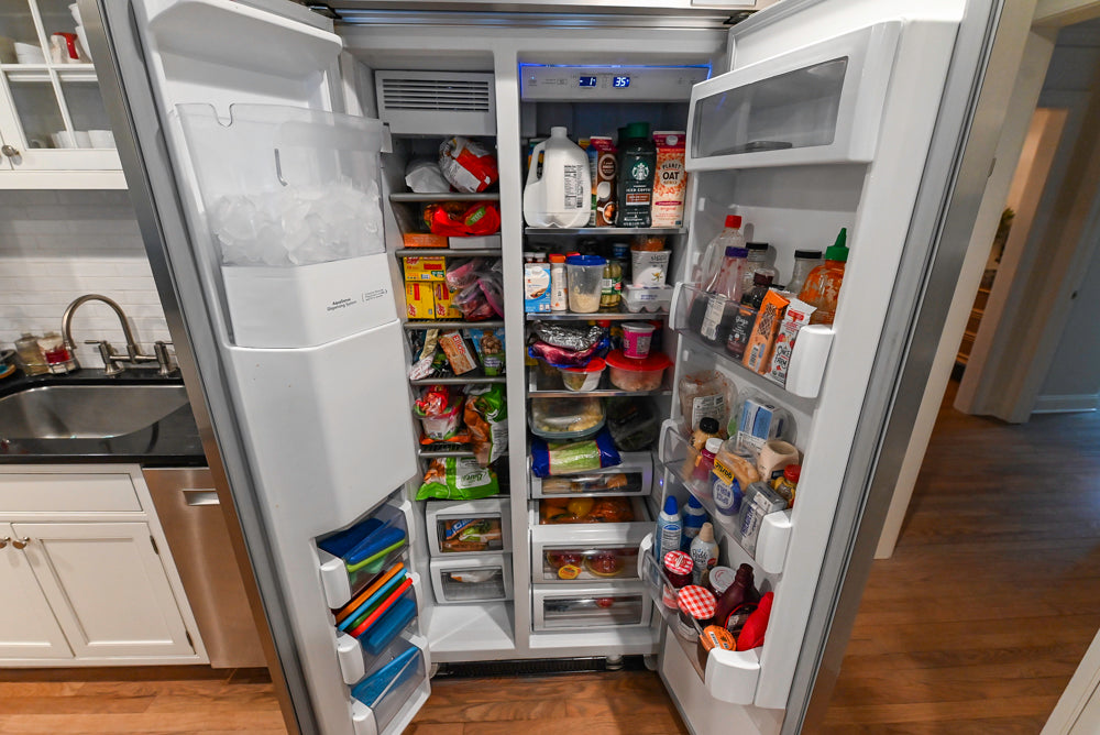 Traditional White Kitchen with Marble Top Island and Appliances