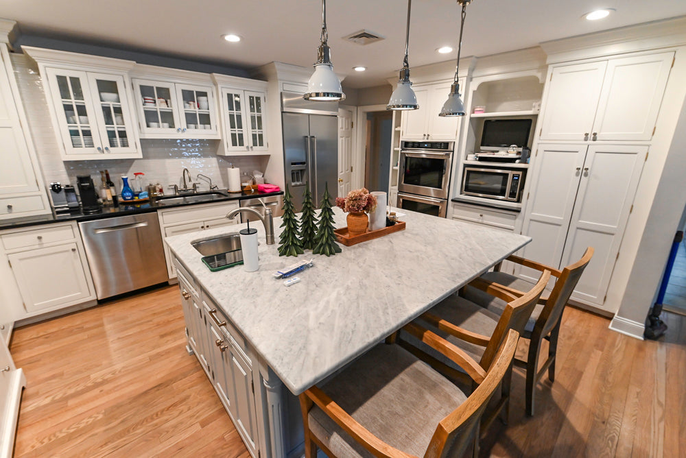 Traditional White Kitchen with Marble Top Island and Appliances