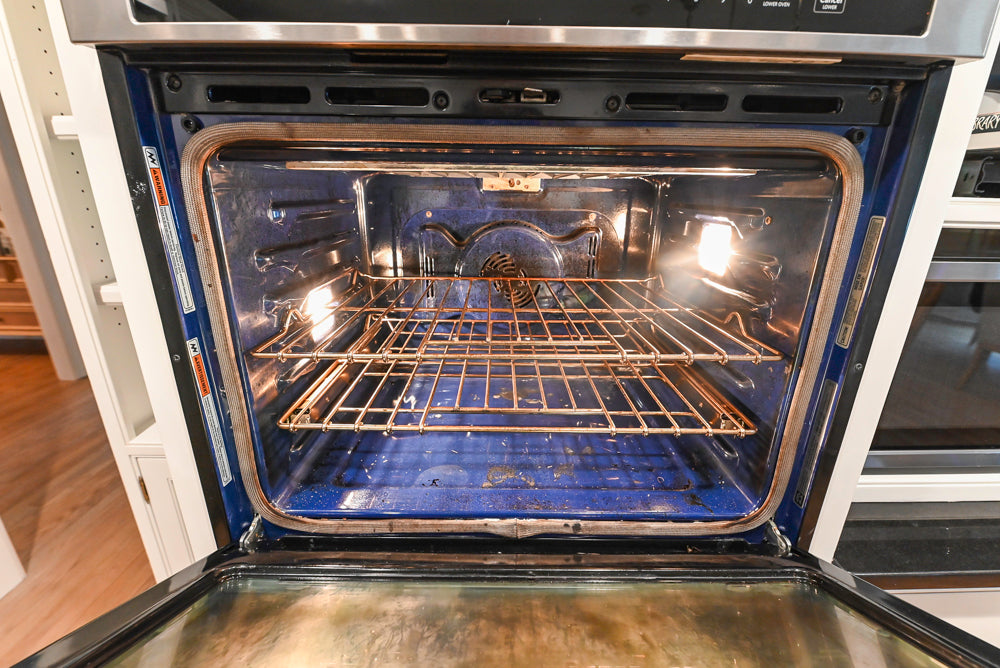 Traditional White Kitchen with Marble Top Island and Appliances