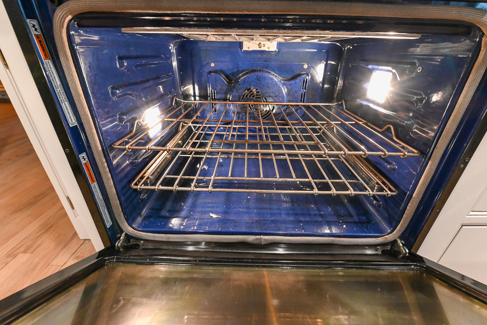 Traditional White Kitchen with Marble Top Island and Appliances