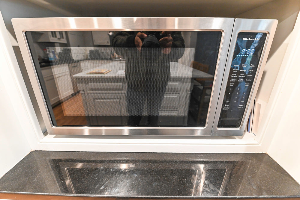 Traditional White Kitchen with Marble Top Island and Appliances