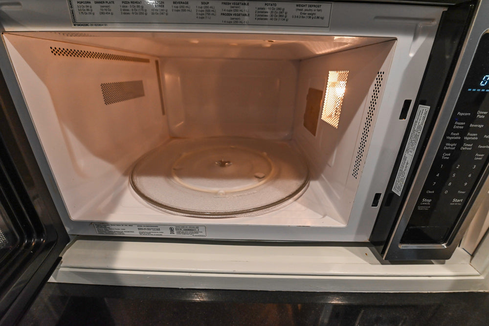 Traditional White Kitchen with Marble Top Island and Appliances