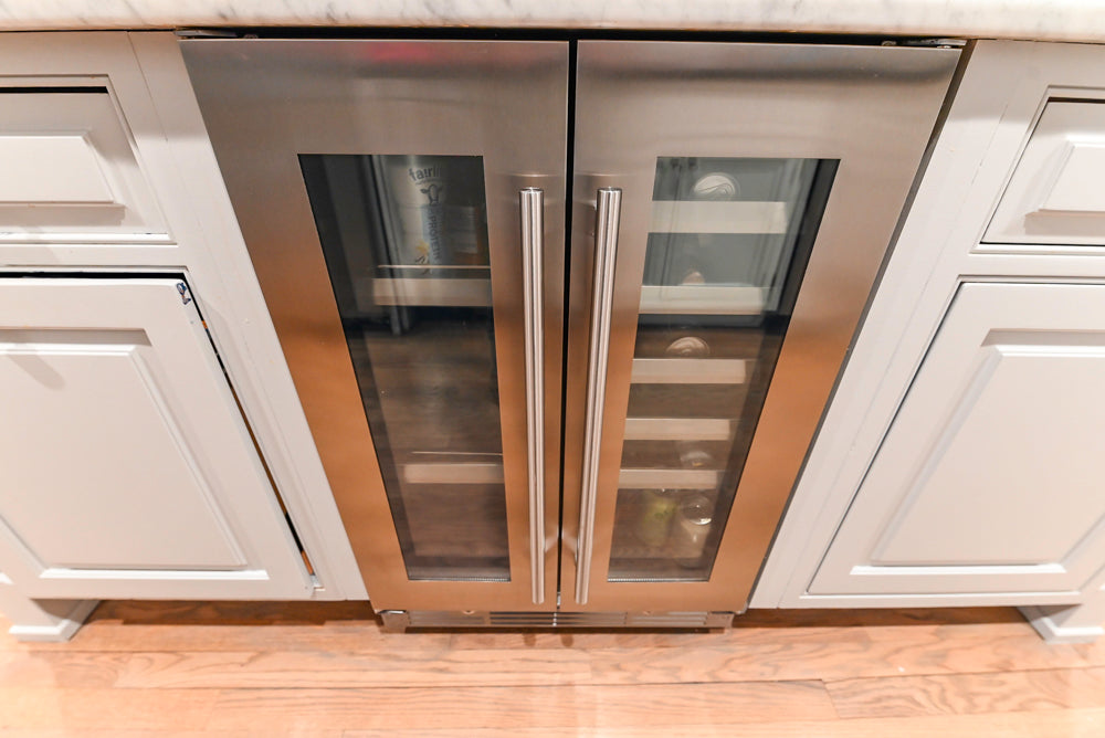 Traditional White Kitchen with Marble Top Island and Appliances