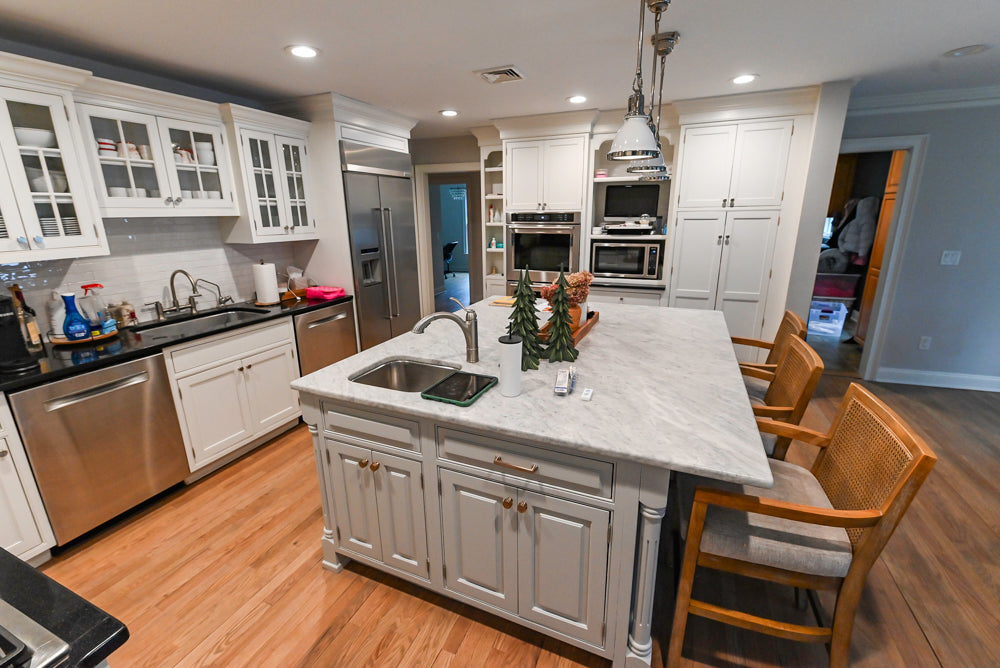 Traditional White Kitchen with Marble Top Island and Appliances