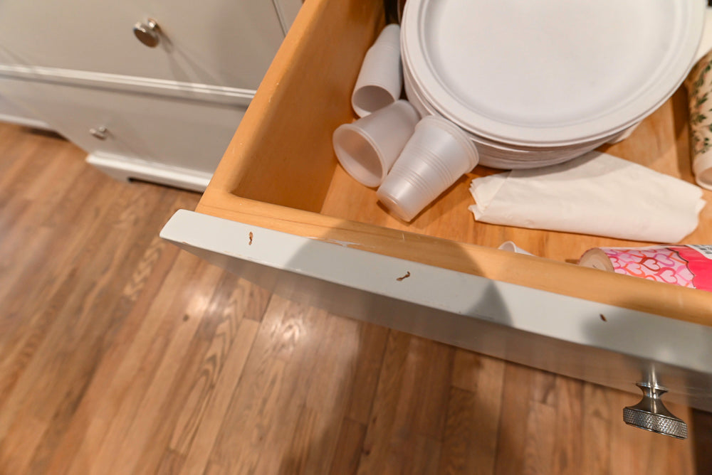 Traditional White Kitchen with Marble Top Island and Appliances